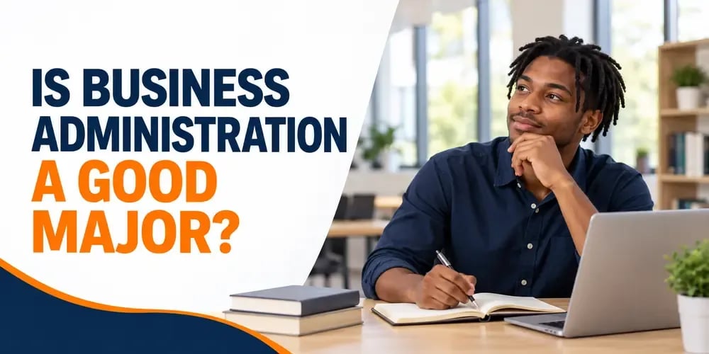 A young man writes in a notebook at a desk, looking up thoughtfully, with the text Is Business Administration a Good Major?